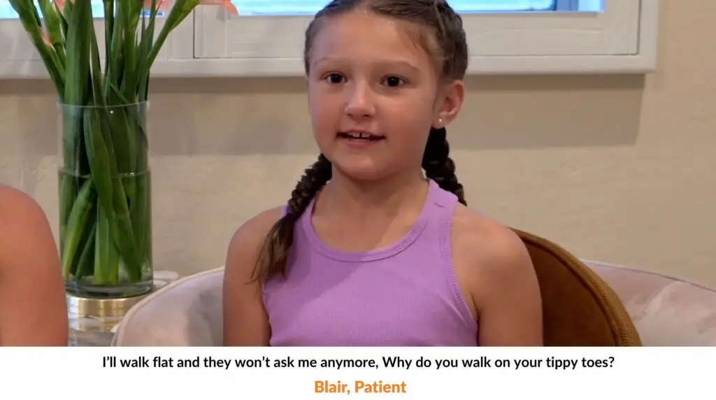 image of little girl in braids, wearing a pink dress sitting down talking about her success in her surgery